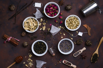 Collection of tea and natural additives in bowls
