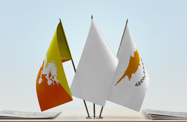 Flags of Bhutan and Cyprus with a white flag in the middle