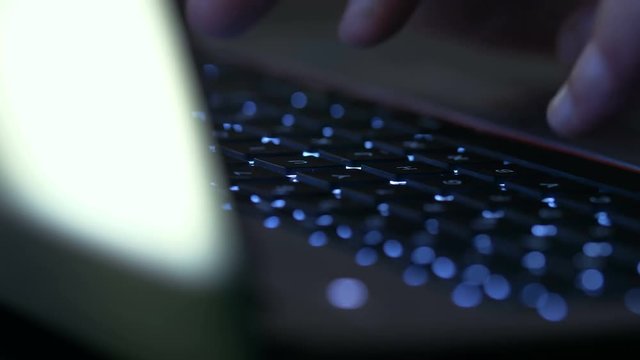 woman's hand typing on laptop's lightning keyboard