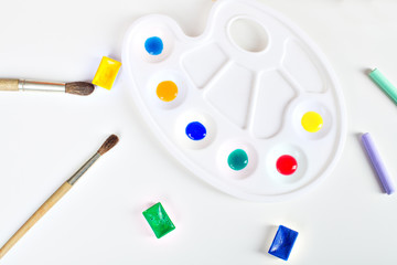 brush, paint, pastel and palette with paints