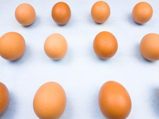Yellow easter eggs on pastel blue background close up macro.