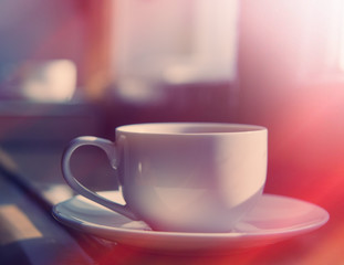 cup of coffee on the window sill.