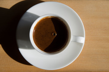 cup of brewed coffee in a saucer