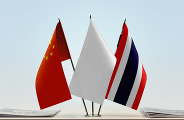 Flags of China and Thailand with a white flag in the middle