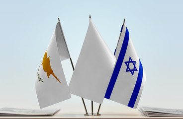 Flags of Cyprus and Israel with a white flag in the middle