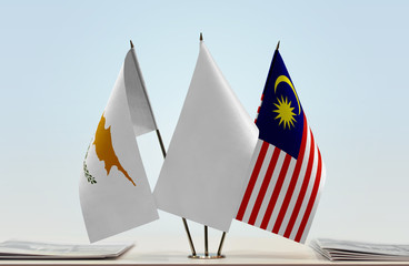 Flags of Cyprus and Malaysia with a white flag in the middle