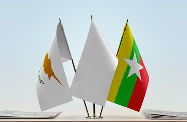 Flags of Cyprus and Myanmar with a white flag in the middle