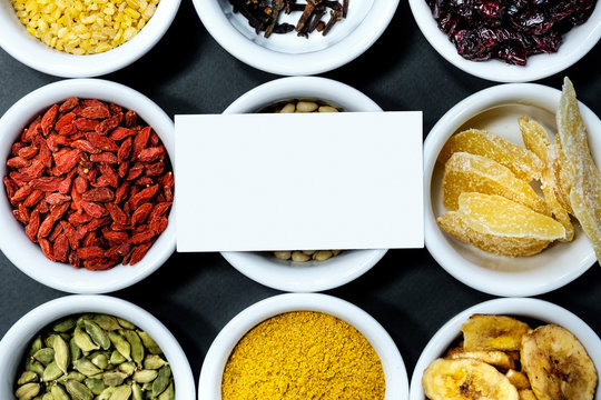 Spices and herbs on a black background with a place for the text on the business card