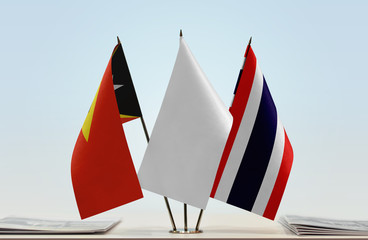  Flags of East Timor and Thailand with a white flag in the middle