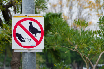 Do not feed the birds Sign in the garden
