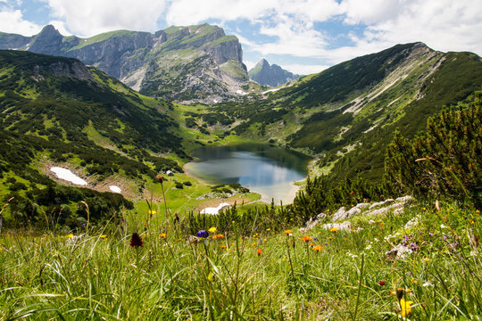 lovely lake in the mountains with cloudy sky