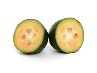 Feijoa isolated on white background. Feijoa fruit in section. Halves of one whole fruit