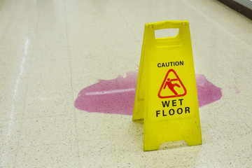 Caution wet floor signs in the supermarket.