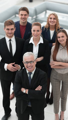 Obraz premium view from the top. group of smiling business people looking at camera.