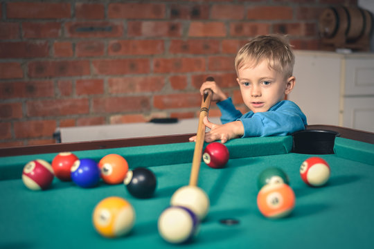 Little Boy Playing Billiard (pool)