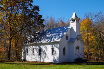 White Country Church in the Autumn Woods