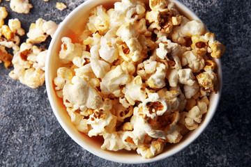 Cinema concept with popcorn in red white bag