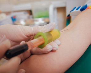 Nurse taking a blood sample. Medical equipment.
