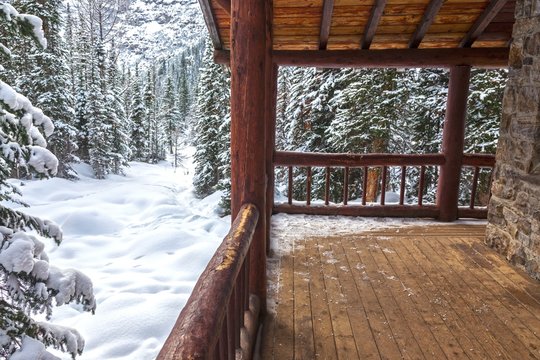 Alpine Teahouse Log Cabin and Snowy Forest Background on Plain of Six Glaciers above Lake Louise in Banff National Park Canadian Rockies