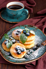 Cottage cheese pancake with blueberry and coffee mug