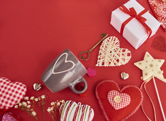 A lot of differen hearts., gift boxes and valentines toy over red background. Design mockup
