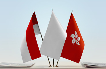 Flags of Indonesia and Hong Kong with a white flag in the middle