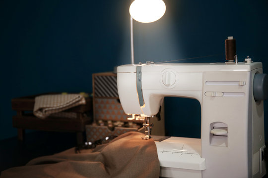 Tailor desk with modern sewing machine