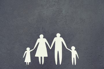 On a gray background the silhouette of the family. Traditional values.