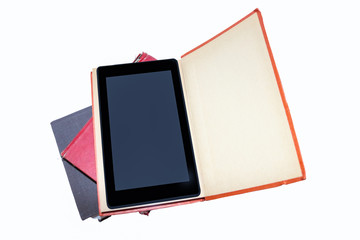 E-reader - Tablet inside an old book on a stack of old books - isolated - room for text