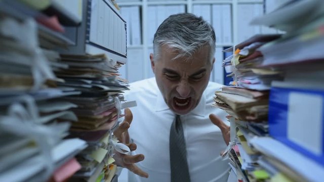Angry businessman shouting in the office