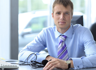 Friendly male helpline operator with headphones