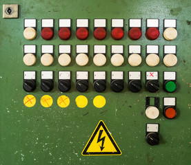 control panel with several unlabeled buttons