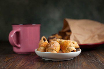 biscuits with berry stuffing on a dark wooden table