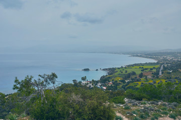 Looking across a campsite towards Chrysohou Bay, Laatchi, Polis and the Akamas Peninsula, Paphos, Cyprus.