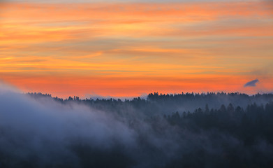 Colorful sky and fog at dawn in the Bieszczady Mountains