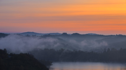Colorful sky and fog at dawn in the Bieszczady Mountains