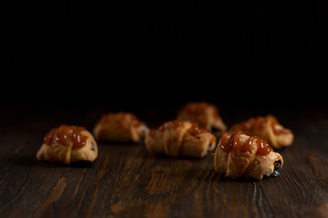 biscuits with berry stuffing on a dark wooden table