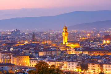 Famous Arnolfo tower of Palazzo Vecchio on the Piazza della Signoria at beautiful sunset in Florence, Tuscany, Italy