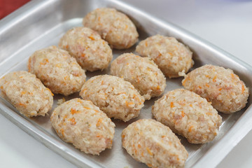 Raw lazy cabbage rolls in pan for baking