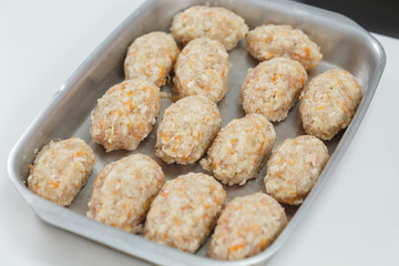 Raw lazy cabbage rolls in pan for baking