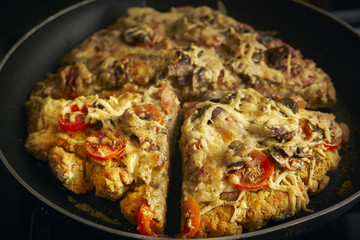Homemade gluten-free pizza in a frying pan