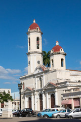 Old cars parked in the Jose Marti Park, in front of the Purisima Concepcion Cathedral. Cienfuegos, Cuba.