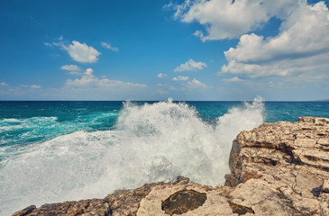 Big waves break about the Rocky Peninsula of Cape Lara in southern Akamas