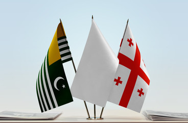 Flags of Kashmir and Georgia with a white flag in the middle
