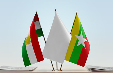 Flags of Kurdistan and Myanmar with a white flag in the middle