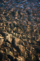 Naklejka premium water rocks in river shallow
