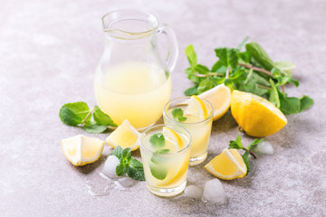 Italian lemon lime liqueur limoncello with ice and mint