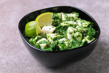 Traditional Indian cuisine. Homemade palak paneer. Copyspace, horizontal view