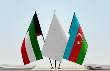 Flags of Kuwait and Azerbaijan with a white flag in the middle