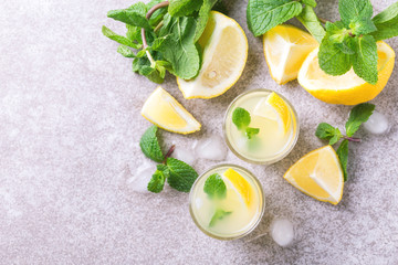Italian lemon lime liqueur limoncello with ice and mint
